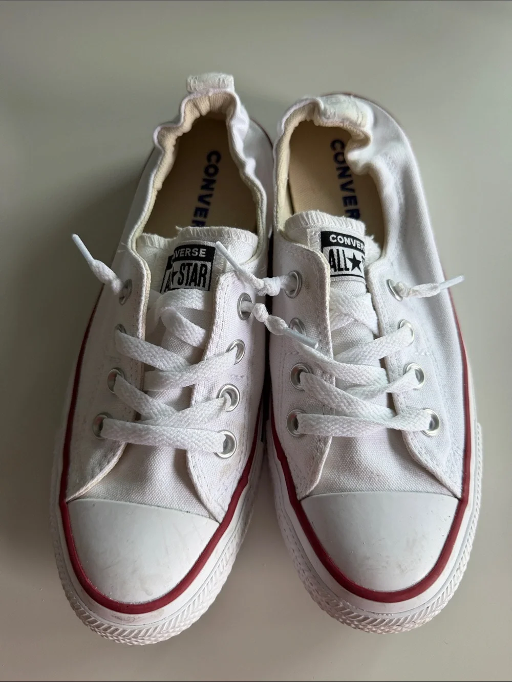 Converse White Low Top Sneakers with Red Trim